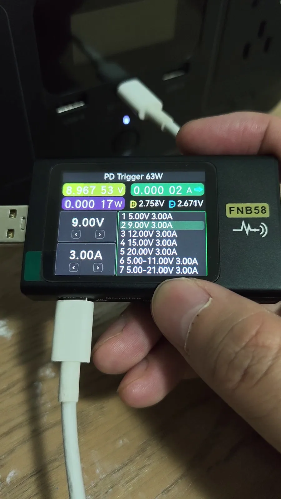 Video frame of an FNB58 in PD trigger mode listing the EcoFlow RIVER 3's 9V 3A profile and the full 7-entry PDO and PPS list